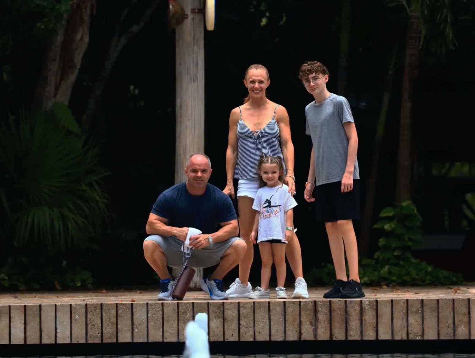 The four of us at Hotel Xcaret México in July 2026: two adults, a teenager, and a four-year-old